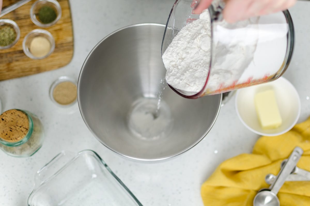 Photo by Samee Anderson person pouring floor in mixing bowl